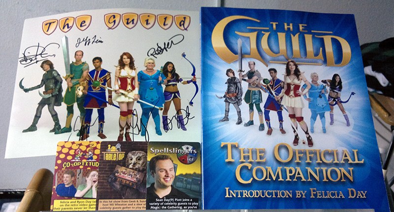 Picture of The Guild companion book and some other signed gifts