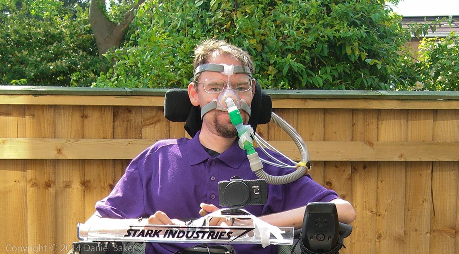 Daniel Baker wearing a purple polo shirt