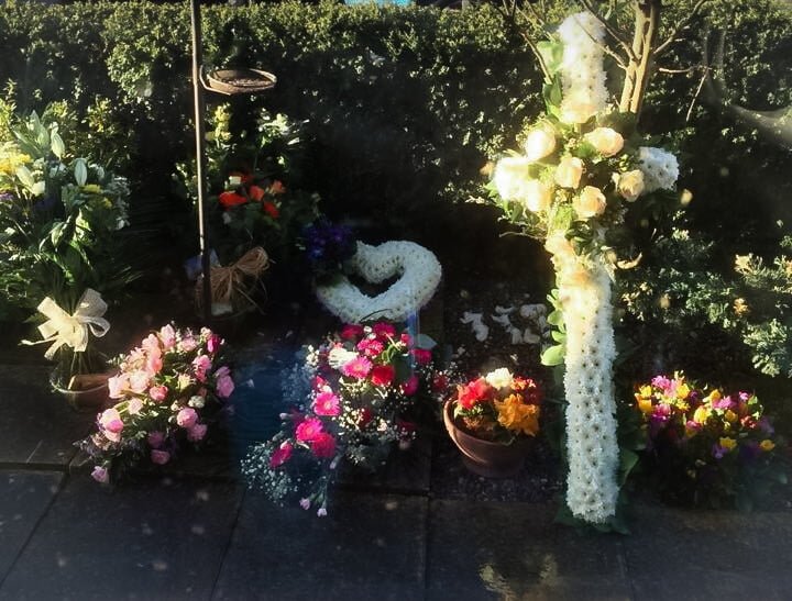 a selection of Funeral Flowers in the sun
