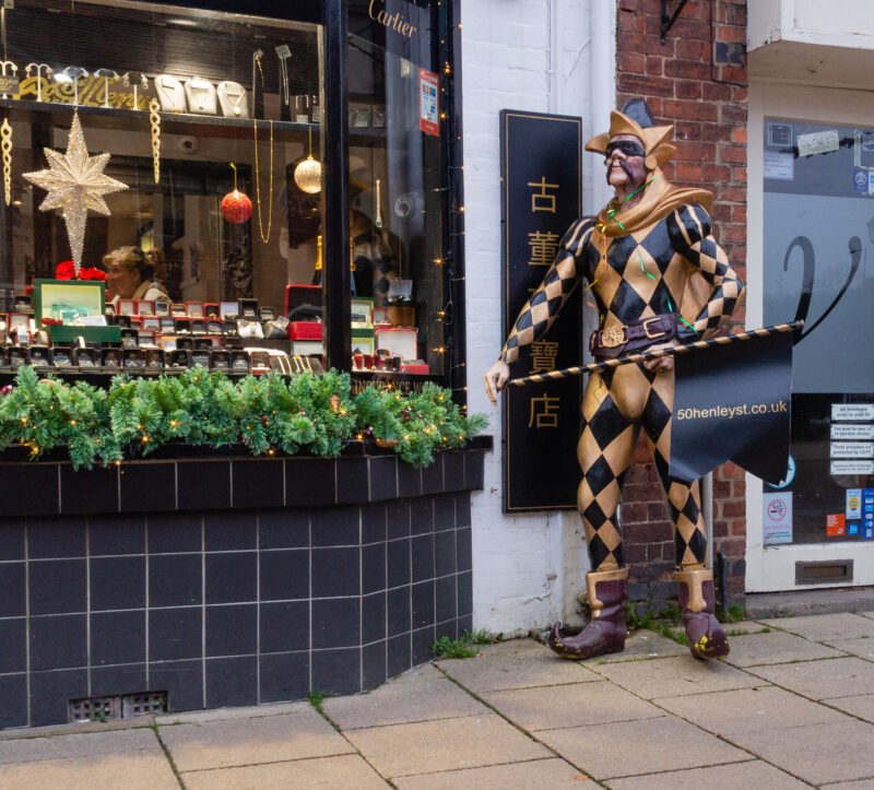 Harlequin statue outside a shop in Stratford-upon-Avon
