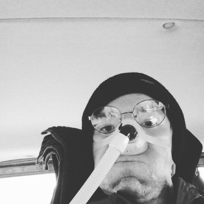 Black and white selfie of Daniel Baker looking panicked stuck in his van