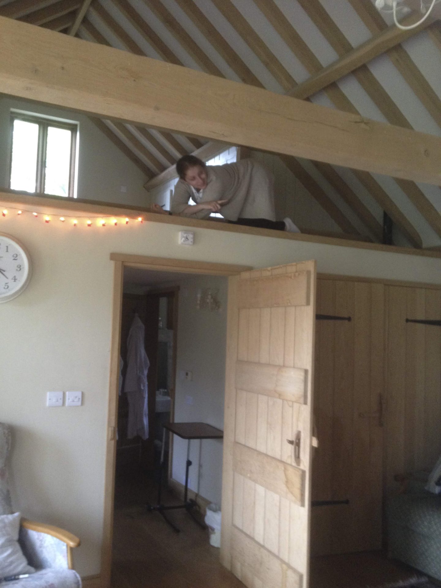 Carer laying in the roof space of the barn