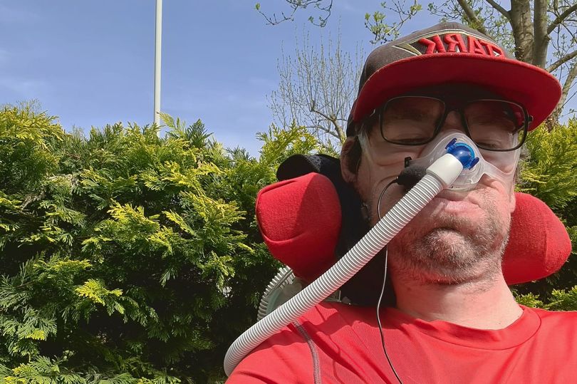 Newspaper article image of Daniel Baker in his front yard wearing a red baselayer and Stark Industries baseball cap - Newspaper and BMJ articles plus site updates
