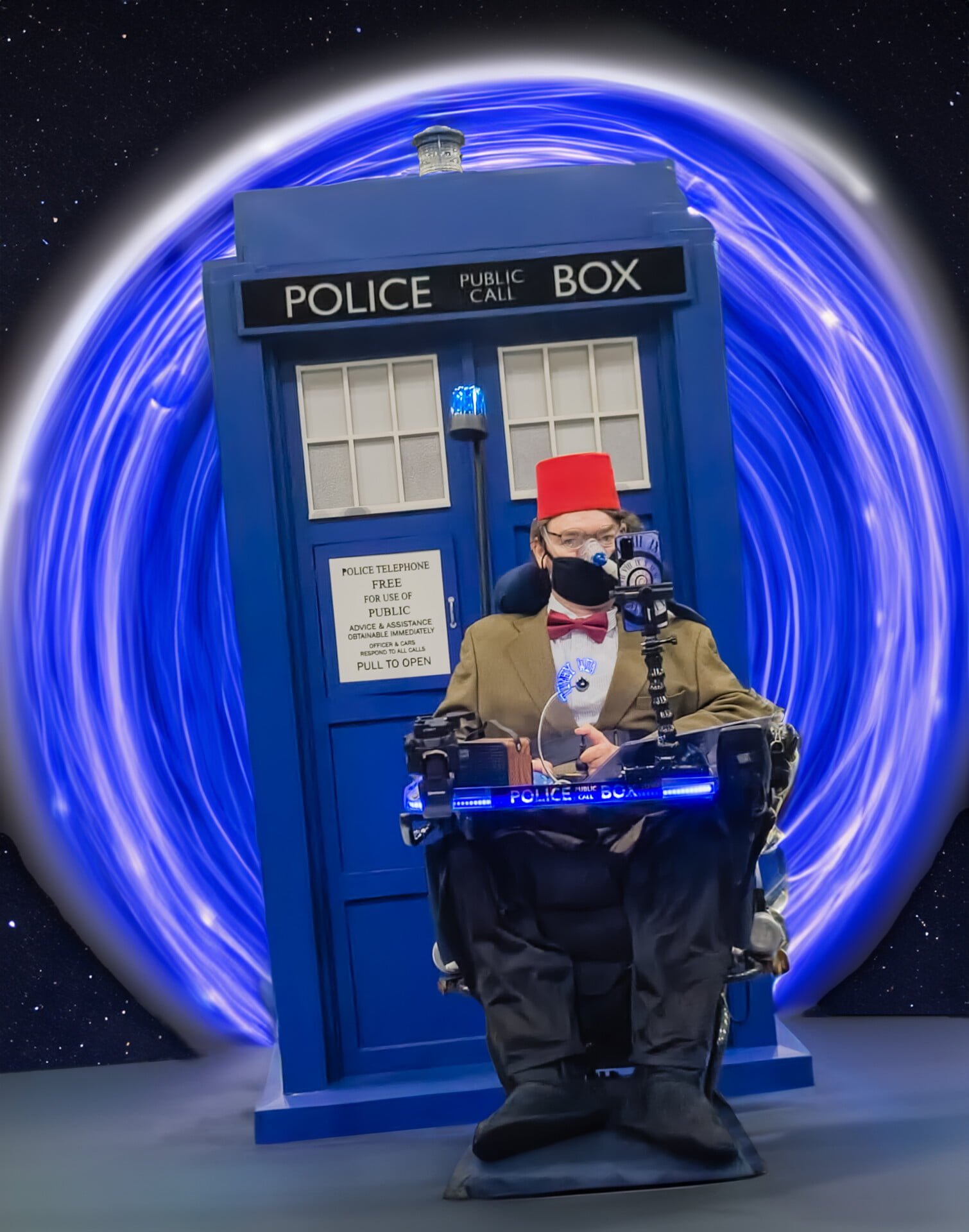 Daniel Baker as the Eleventh Doctor in front of a TARDIS