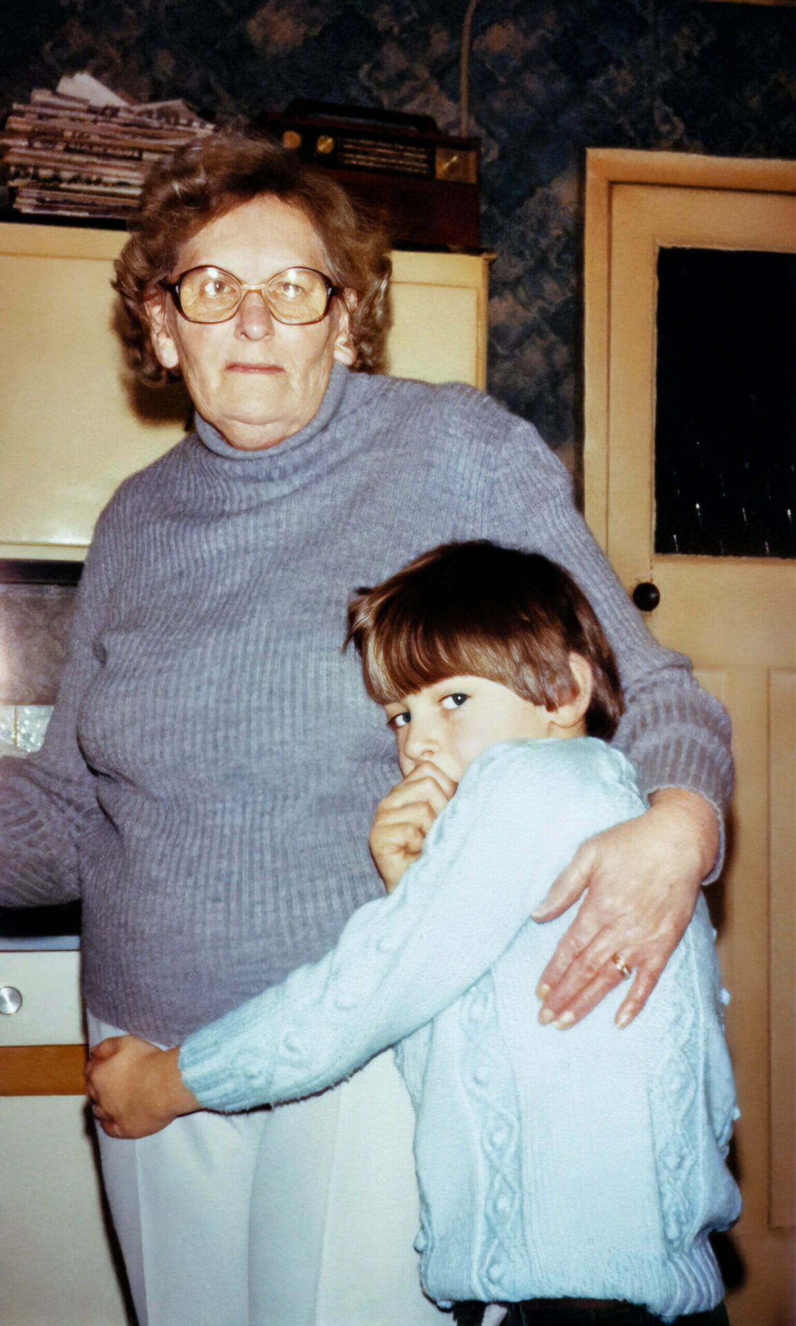 Daniel and his Nan in a kitchen.