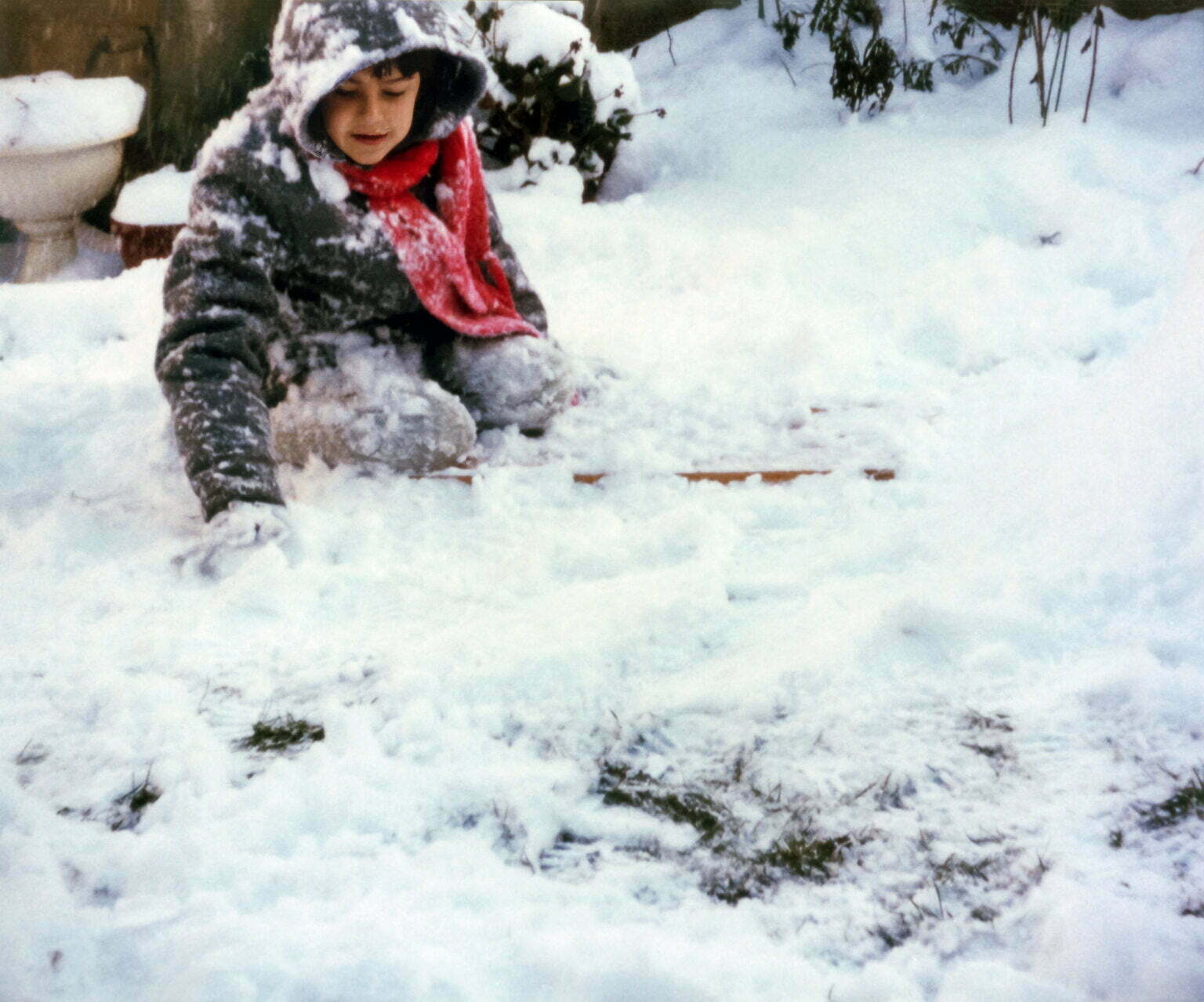 A young Daniel Baker playing in the snow