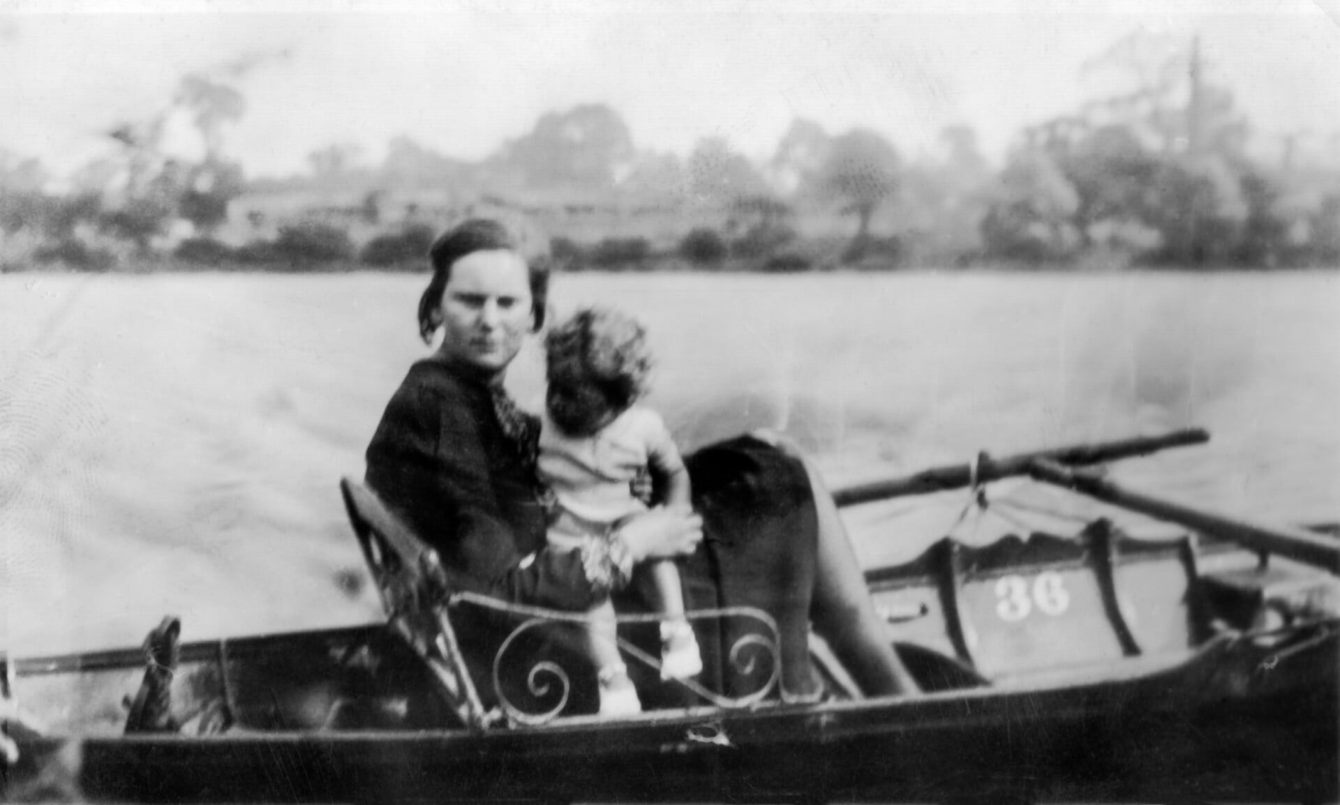 Black and white photo of a woman holding a child