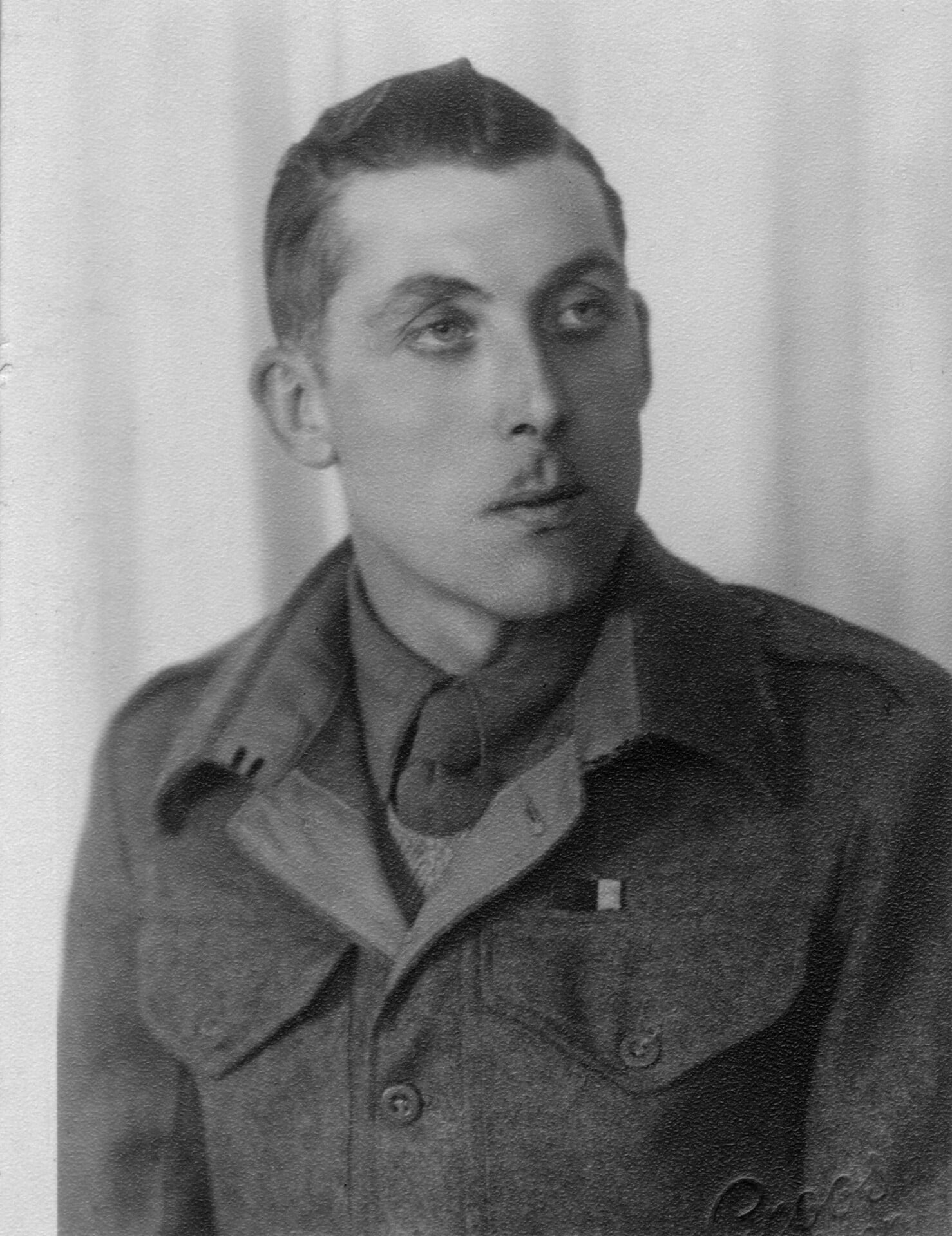 A black and White photo of a soldier in uniform