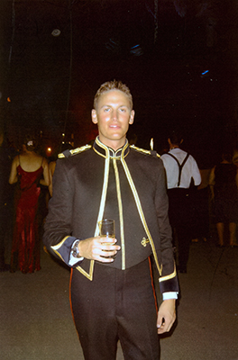 Martin Baker in relaxed dress uniform holding a glass