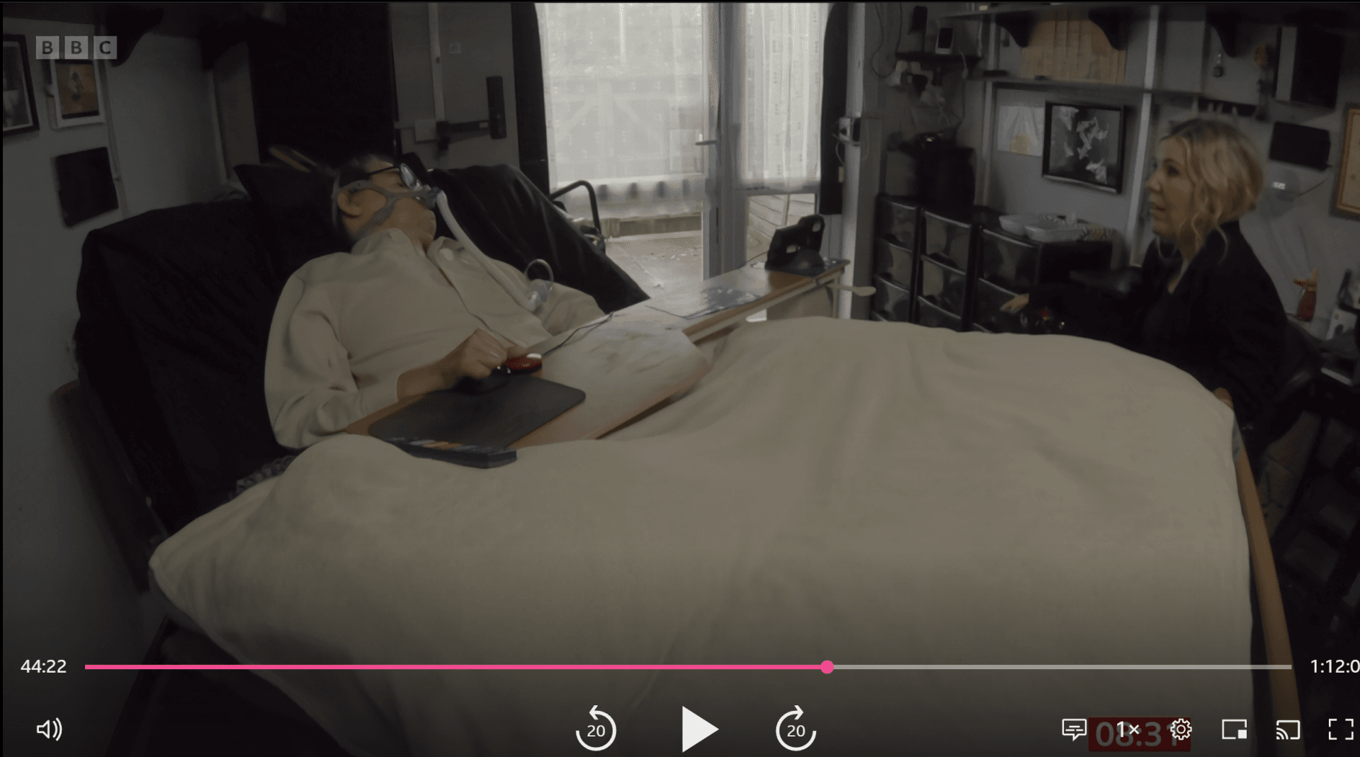 screenshot from Accessible Housing with Nikki Fox interview with Daniel Baker laying in bed talking with Nikki.